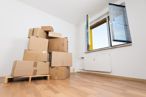 Packed boxes and furniture ready for a man and van move in Mortlake