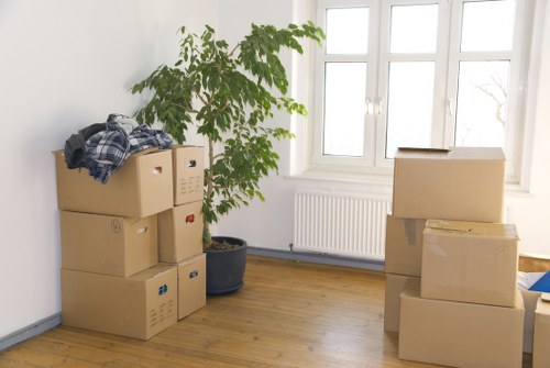 Packed office technology and furniture ready for relocation in Mortlake