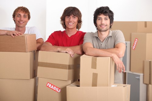 Team preparing workstations for an office move in Mortlake